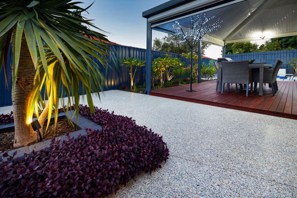 Honed concrete outdoor patio surrounding modern garden