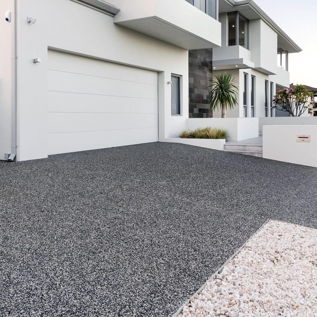 Exposed aggregate driveway in front of modern Perth home